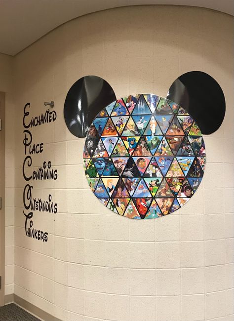 Epcot logo made with individually cut pieces of Disney movies. Epcot Classroom Theme, Disney World Classroom, Disney Theme Classroom Ideas, Classroom Door Disney, Disney Teacher Door Decorations, Subtle Disney Classroom, Disney Inspired Classroom Doors, Disney Classroom Theme, Disney Bulletin Boards