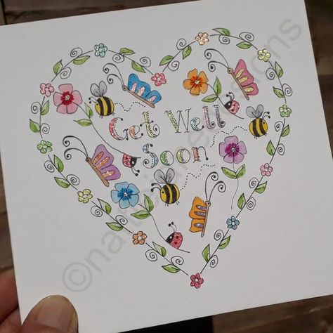 This is an original hand drawn,hand painted,hand lettered watercolour card. Features a pretty heart filled with pretty delicate flowers,butterflies,bees and ladybirds around the words get well soon. The smaller outer flowers are done with sakura glitter pens so they sparkle. The center of the Get Well Soon Cards Diy Watercolor, Watercolour Get Well Soon Cards, Get Well Watercolor Cards, Hand Drawn Greeting Cards, Handmade Get Well Soon Cards, Get Well Soon Card Ideas, Get Well Soon Cards, Baby's First Christmas Card, Get Well Soon Card