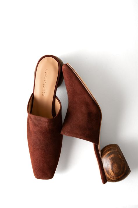 A round, hand-sculpted heel and classic materials make this mule timeless. 65 mm heel Suede upper, leather lining and sole Responsibly handmade in Peru Runs true to size; half sizes or wide widths, order next size up Whole sizes only