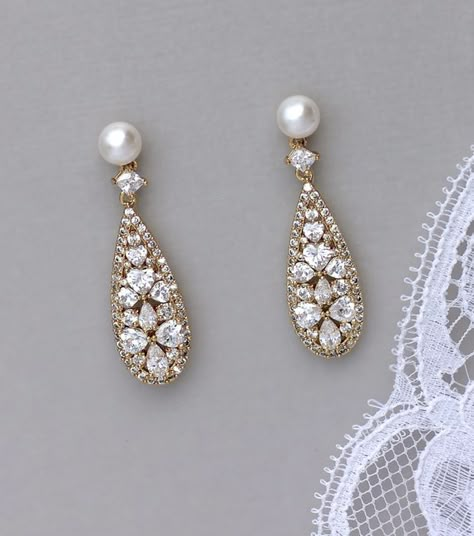 Rita earrings have been created in a modern vintage filigree long teardrop with a pearl stud post for a graceful and super sparkling bridal accessory. Very light and comfortable to wear, theyre a perfect finish to your wedding dress accessorizing whether its modern or in a vintage style. Cheap Gold Bridal Earrings For Festive Occasion, Luxury Gold Pearl Bridal Earrings, Gold Teardrop Earrings Wedding, Luxury Gold Pearl Earrings For Wedding, Luxury Gold Drop Bridal Earrings, Cheap Gold Round Bridal Earrings, Affordable Vintage Wedding Earrings, Cheap Vintage Wedding Earrings, Luxury Gold-plated Bridal Earrings With Pearl Drop