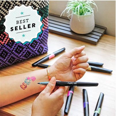 These ideas are sure to impress! - Good Housekeeping Tattoo Markers, Teen Easter Basket, Exploding Kittens Card Game, Tattoo Maker, Stocking Stuffers For Teens, Moon Phases Necklace, Free Stencils, Popular Toys, Good Housekeeping