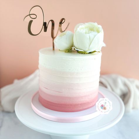 Floral pink ombré cake for celebrating one’s first birthday. #cake #pink #pinkcake #ombrecake #ombre #one #onecake #babycakes #peonies #floralcake Ombre First Birthday Cake, 1st Birthday Cake Flowers, Mauve Birthday Cake, Ombré Pink Cake, Rose Gold Smash Cake, Pink And White Smash Cake, Ombre Cake Pink, Light Pink Birthday Cake, Ombre Cake Ideas