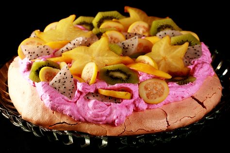 Tropical Dragon Fruit Pavlova - Celebration Generation Dragonfruit Dessert, Dragon Fruit Dishes, Tropical Dragon, Fruit Pavlova, Tropical Fruit Pavlova, Passionfruit Pavlova, Big Marshmallows, Dragon Fruit Pitaya, Rum Extract