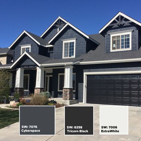 Here is a black and dark blue house color scheme that will get your house some need attention.  Amazing exterior color schemes.  For more color ideas visit our Instagram page:  https://www.instagram.com/idahopainter/ Navy And Black House Exterior, Dark Exterior Paint Colors For House White Windows, Charcoal Blue Exterior House, Blue House Black Trim, Grey Blue Exterior House Colors, Blue Brick House Exterior, Navy Blue House Exterior, Modern Black Houses, Grey House White Trim