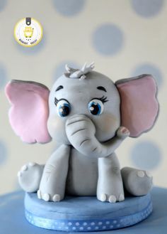 A welcome back cake made for a little boy who was visiting his grand parents for holidays. His current love is ele, animals and the colour blue. Hence came up with this design! Just loved working on this one. Torturi Baby Shower, Dumbo Cake, Fondant Elephant, Elephant Cake Toppers, Elephant Cakes, Safari Cakes, Baby Elefant, Cake Topper Tutorial, Fondant Animals