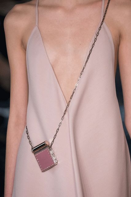 Micro Bags Are Getting Smaller & Smaller #refinery29  http://www.refinery29.com/2016/10/125135/valentino-baby-bags-pfw-spring-2017#slide-6  Stick to a solid color...... Micro Purse, Statement Purse, Micro Bags, Street Style Bags, Micro Bag, Dress Bag, Spring Accessories, Small Baby, Bag Trends