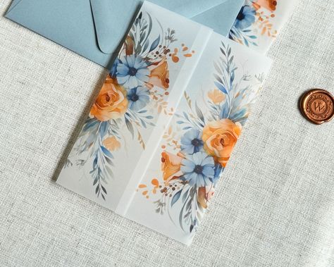 Use these pretty dusty blue and burnt orange watercolor flower vellum Jackets to accessorize your classy wedding invitations!  ------------- DETAILS: Light Weight (30#) or Heavy Weight (42#) Translucent Vellum Jackets Fit 5" x 7" Invitations Ship Flat, Scored or Folded ------------- SPECS ---30# wraps arrive flat, for you to fold them perfectly around your A7 Invitation ---42# wraps arrive scored or folded, for a generic fit Printed with archival, bold inks for a matte, semi-transparent look. Light Blue Orange Wedding, Dusty Blue And Amber Wedding, Light Blue And Orange Wedding Theme, Orange And Blue Wedding Invitations, Orange And Dusty Blue Wedding, Light Blue And Orange Wedding, Terracotta And Dusty Blue Wedding, Dusty Blue And Orange Wedding, July Wedding Invitations