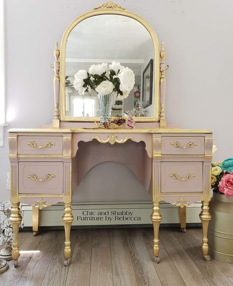 This is a 1932 vintage vanity. It ended up needing more work than I thought. Sanded, side panels replaced, shellac, mud, sanded and mudded again. 😆  Done in Dixie Belle Paint Company Tea Rose, gold leaf re•design with prima®️ transfers and moulds and sealed in Gator Hide.  Local and out of state delivery available. #share Vanity Pink, Shabby Furniture, Rose Gold Leaf, Pink Furniture, Dixie Belle Paint Company, Dixie Belle Paint, Painting Furniture Diy, Tea Rose, Refurbished Furniture