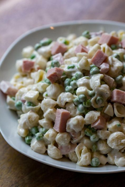 My easy Ham and Pea Pasta Salad is the perfect side to bring to any barbecue or cookout! Use a good deli ham steak, or my leftover Double-Smoked Pineapple Glazed Ham if you really want to win bbq friends, but either way, it’ll be delicious. Ham and pea pasta salad offers a spin on my macaroni salad. Ham and peas add plenty of protein to macaroni salad so it is like a bit of an upgrade on the filling and fulfilling side of a typical pasta salad. Ham And Pea Pasta Salad, Pea Pasta Salad, Smoked Pineapple, Ham Pasta Salad, Ham And Peas, Cheese Peas, Pea Pasta, Ham Steak, Creamy Pasta Salads