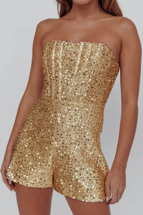 Gold, sequin romper Strapless style Lined Boning in bodice Zipper in back Get their attention in our gorgeous Vivid Dreams romper. We are obsessed with its sequin-embellished fabric and chic, structured bodice. Perfect for a big, birthday celebration. Team it with strappy, silver heels and a clutch for a look that's sure to turn heads. MODEL INFO Model is wearing size XS Height: 5'6" Bust: 32.0" Waist: 23.0" Hips: 34.0" CARE Hand Wash Cold. Do Not Iron. MATERIAL POLYESTER Gold Sequin Romper, Gold Romper, Embellished Fabric, Shimmery Dress, Party Rompers, Sequin Rompers, Vivid Dreams, Blue Bridesmaids, Date Night Dresses