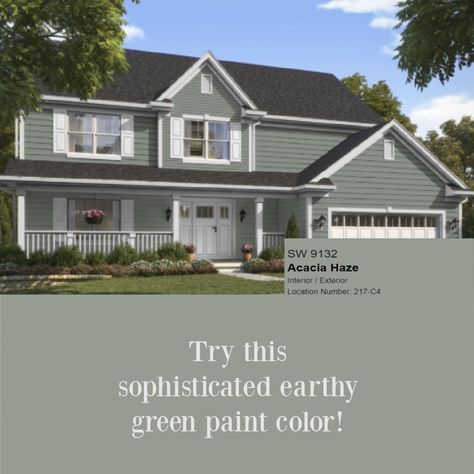 Acacia Haze 9132 SW paint color is an earthy green shown here on a house exterior - Hello Lovely. #acaciahaze #greenpaint Acacia Haze Sherwin Williams Exterior House, Best Green House Colors, Sw Acacia Haze Exterior, Sherwin Williams Acacia Haze Exterior, Acacia Haze Exterior House, Acacia Haze Exterior, Grey Green House Exterior, Acacia Haze Sherwin Williams Exterior, Green Painted House Exterior