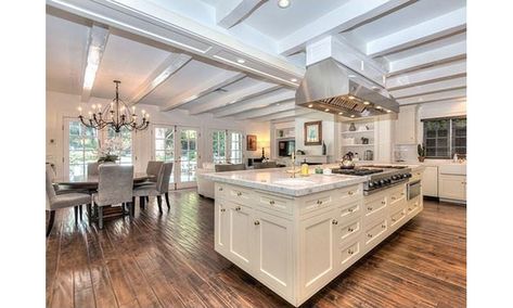 An open-concept kitchen and large island is the perfect space for cooking up a feast. <br><p>Photo: © Douglas Elliman/MLS</p> Houses Interior Kitchen, Celebrity Kitchens, Mansion Kitchen, Mansion Homes, Beverly Hills Mansion, Houses Interior, Beverly Hills Houses, Dream Kitchens, White Marble Countertops