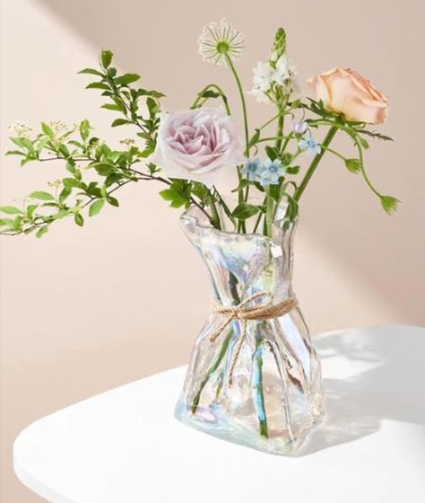 This iridescent glass flower vase captures people's attention with its unique and creative design. Decorative vase perfectly matched with natural woven grass rope, injecting new inspiration and style, creating a Unique artwork. Perfect for weddings, bridal showers, gifts, parties, housewarming gifts, and any occasion. 

#decor #vase #flowers #homedecor #interiordesign #bouquet #weddingdesign #bridaldesign #weddinggifts #spring #summer #giftsforher #romanticgift #cheapgiftideas #giftideas #table Glass Flower Vase, Vase Flowers, Decor Vase, Centerpiece Table, Glass Flower Vases, Vase Centerpieces, Cheap Gifts, Housewarming Gifts, Romantic Gift