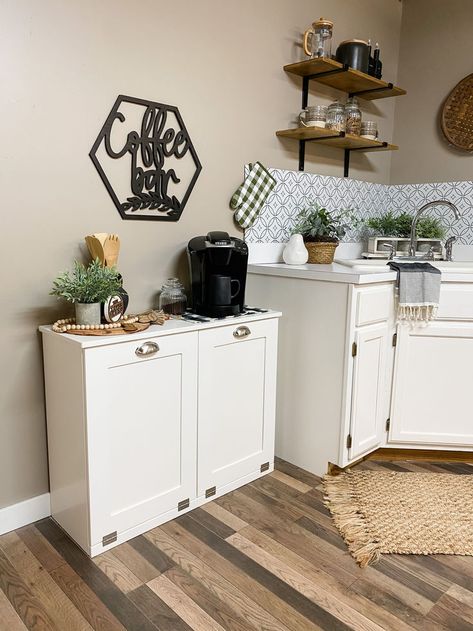 Revolutionize your kitchen with our space-saving Trash Can Cabinet. It's not just a bin – it's a stylish solution to keep your space clutter-free. Embrace functionality without compromising on design! At-home coffee bar inspiration. Coffee Bar Inspiration, Farmhouse Coffee Tables, Tilt Out Laundry Hamper, Can Cabinet, Trash Can Cabinet, Farmhouse Style Furniture, Laundry Hampers, Storage Benches, Bar Inspiration