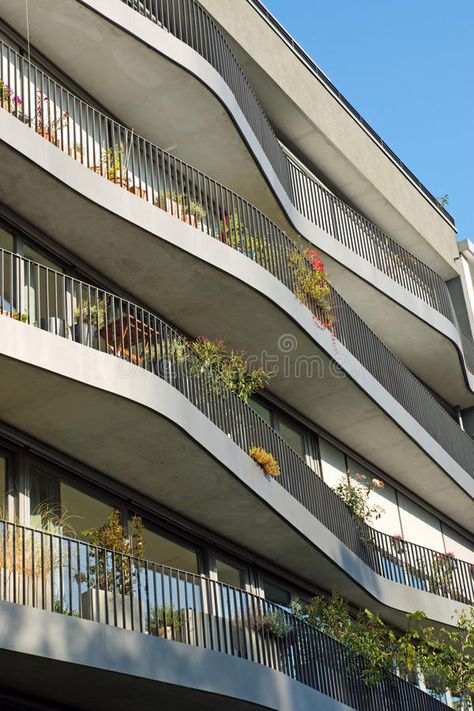 Modern apartments with curved balconies. In Berlin stock photos Curved Apartment Building, Curved Hotel Architecture, Curved Balcony Architecture, Curved Facade Design, Curved Facade Architecture, Open Balcony Ideas, Curved Balcony, Curved Building, Curved Facade