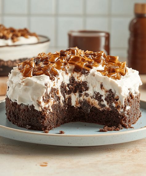 This indulgent Heath Bar poke cake combines moist chocolate cake, caramel, and whipped topping with crushed Heath bars for the Heath Bar Poke Cake Recipe, Poke Hole Cake Recipes, Heath Poke Cake, Heathbar Cake, Heath Bar Poke Cake, Heath Bar Recipes, Heath Bar Cake Recipe, Poke Hole Cake, Heath Cake