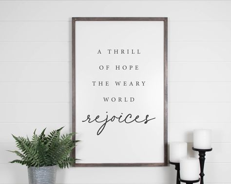 "A Thrill Of Hope A Weary World Rejoices Sign, Wall Hanging, Christmas Sign, Christmas Decor, Farmhouse Decor, Holiday Decor SIZES:  24x16 inches 30x20 inches 36x23 inches (all dimensions can vary by 1/2\") (White background with your choice of frame and lettering color). ➤ Our signs are all handmade and are of the Highest Quality. ➤ All wooden sign backgrounds are made with Premium Birch plywood, and coated with a very high-quality paint. An extremely high quality, VOC-free, UV ink is used for the lettering. ➤ The frames are all handmade from carefully selected solid White Pine. The frames are stained with your choice of stain colour, and sealed with a topcoat to protect the finish for years to come! ➤ We go a step further in our build process, by using a technique on the back of the fram A Thrill Of Hope A Weary World Rejoices, A Weary World Rejoices, Cookie Projector, Weary World Rejoices, A Thrill Of Hope, Thrill Of Hope, Colorful Christmas Decorations, Christmas Decor Farmhouse, Wall Hanging Christmas