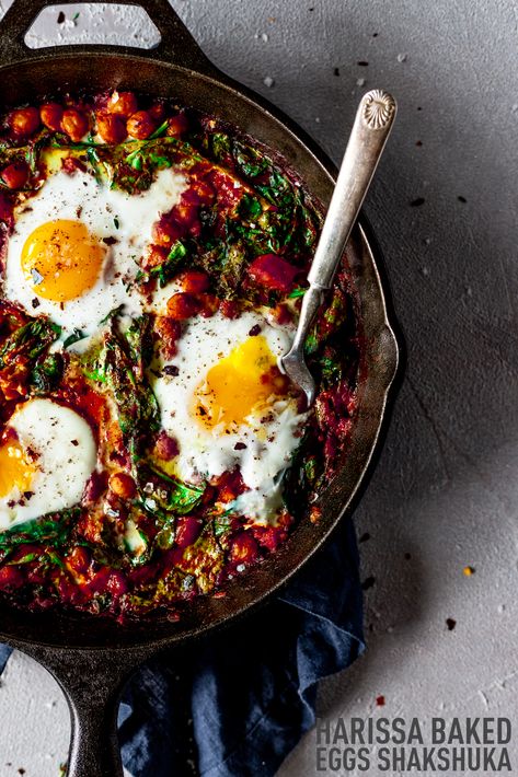 Bold Mediterranean flavors turn a simple shakshuka into something new and exciting when you whip up this harissa baked eggs recipe! With rich aromatics, savory chickpeas, spicy harissa and pepper flakes, this dish packs enormous flavor in mere minutes in a single skillet and is perfect for breakfast or dinner! From Minneapolis Food Blogger Karly Gomez | asimplepantry.com Skillet Ratatouille, Sumac Recipe, Recipe With Chickpeas, Minneapolis Food, Sumac Recipes, Baked Eggs Recipe, Mediterranean Spices, Skillet Dishes, Breakfast Burger