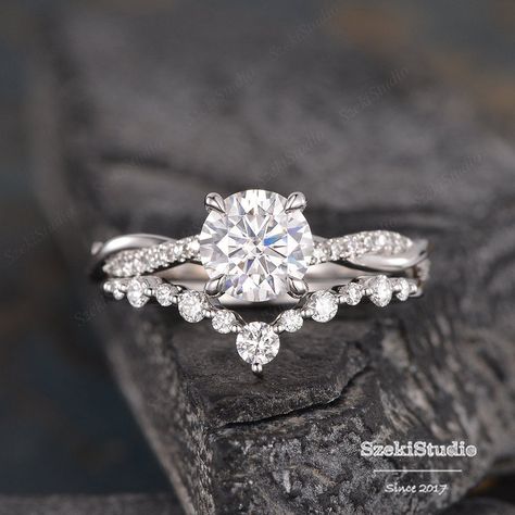 "White Gold Moissanite Engagement Ring Bridal Set Twist Infinity Solitaire Diamond Half Eternity Ring Bridal Women Promise Anniversary 2pcs Link for the main ring only: https://www.etsy.com/listing/623426001 Link for the same design with moonstone: https://www.etsy.com/listing/737678010/moonstone-bridal-set-white-gold?ref=shop_home_active_14&frs=1 ITEM INFORMATION Metal Type - Solid 14k Rose Gold Band Width - (approx. 2.3mm) Engagement Ring** Center Stone - 7mm Moissanite, Round Cut Clarity Elegant Engagement Rings Set, Moissanite Engagement Ring And Band, Twisted Engagement Rings With Wedding Band, Wedding Bands For Infinity Rings, Wedding Rings Engagement With Band, White Gold Engagement Rings And Wedding Band, Wedding Bands For Women With Twisted Engagement Ring, Wedding Bands With Twist Engagement Ring, Wedding Bands For Twisted Engagement Rings