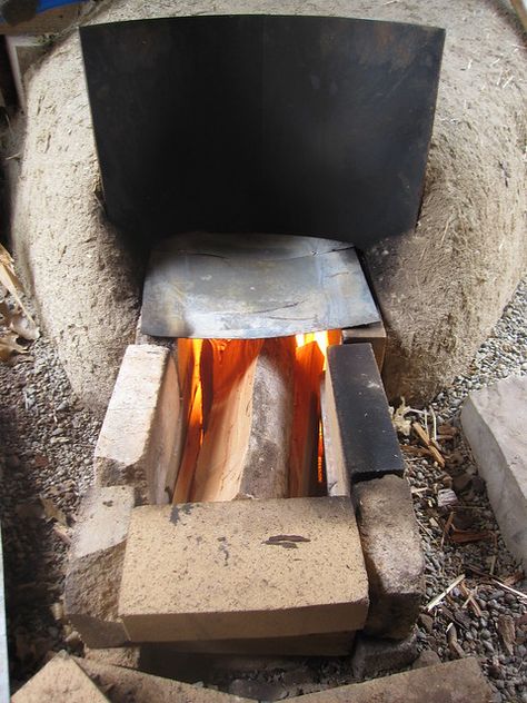 rocket mass floor heater -- finally completed and it works! (rocket mass heater forum at permies) Make A Volcano, Rocket Heater, Rocket Stove Mass Heater, Floor Heater, Mass Heater, Rocket Mass Heater, Thermal Mass, Wood Fuel, Cast Iron Tub