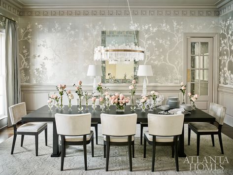 A traditional wall covering by Gracie Studio juxtaposes the modern table and chairs from Christian Liaigre in the formal dining room. The rock crystal chandelier is by Coup D’Etat from R Hughes. French Inspired Decor, Suzanne Kasler, Dining Room Wallpaper, Dining Room Walls, Room Wallpaper, Formal Dining Room, Dining Room Design, Modern Table, Formal Dining