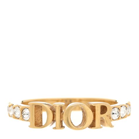 This is an authentic CHRISTIAN DIOR Metal Crystal Dio(R)evolution Ring size M 52 or 6 in Gold. This delightful ring features a gold band with crystals and a DIOR logo at the center. 1422804 Jewelry Tour, Dior Mimirose Ring, Christian Dior Ring, Christian Dior Ring Gold, Dior Jwellary, Christian Dior Necklace Gold, Bday List, Dior Logo, Dior Jewelry