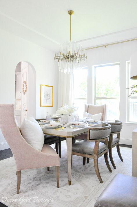 Beautiful white and blush dining room with a transitional design. #decorating #interiordecorating #decor #interiordecor #interiordesign #decoratingideas #homedecor #homedecorating #interiorstyling #designtips #homedecorideas #diningroom #diningroomdecor #diningroomdesign Blush Pink Tabletop Essentials Glam Breakfast Nook, Bjursta Table, Pink Goblets, Solid Wood Dining Set, Gold Designs, Décor Boho, Decor Essentials, Cozy Decor, Transitional Decor