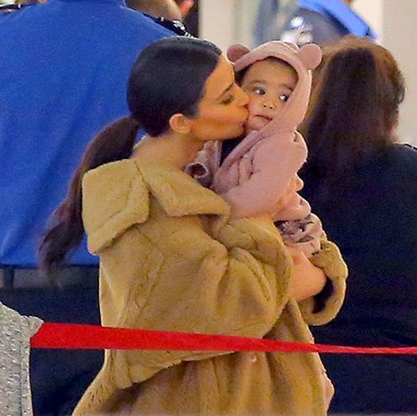 Kim Kardashian kisses daughter North (wearing a hoodie with animal ears!) at JFK Airport on Feb. 25 Kim Kardashian Kiss, Animal Ear Hoodie, North West Baby, Kim Kardashian And North, Kim And North, Kanye West And Kim, Mommy Loves You, Kardashian Kids, Kim Kardashian Style