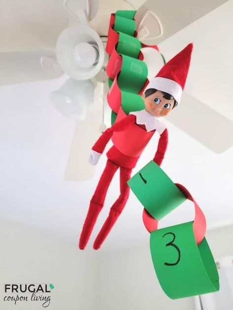 Countdown the days until Christmas with this fun paper chain craft. Elf on the Shelf countdown to Christmas ideas including how to make a  paper chain and hang on a celling fan. New Elf on the Shelf ideas daily plus free Elf on the Shelf printables. #FrugalCouponLiving #ElfontheShelf #ElfontheShelfIdeas #ElfIdeas #funnyelfideas #funnyelfontheshelf #elfprintables #freeelfprintables #printables #freeprintables #ElfonaShelf #ScoutElfIdeas Elf Countdown, Elf On The Shelf Paper Chain, Elf On The Shelf Christmas Countdown, Elf Countdown To Christmas, Paper Chain Christmas Countdown, Paper Chains Christmas Countdown, Elf Hanging From Chandelier, Paper Straws Crafts, Streamer Decorations