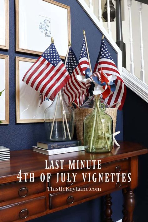 Last Minute 4th Of July Vignettes - Create three different last minute patriotic vignettes with flags to add any table top or kitchen table. American Flag Display In Demijohn. Patriotic Entry Table Styling. Red, White And Blue Decorating Ideas. How To Display American Flags On A Table Top Arrangement. Blue Decorating Ideas, Entry Table Styling, Patriotic Kitchen, Buffet Table Decor, Small Patio Decor, Summer Living Room, Flag Display, Styling A Buffet, American Flags