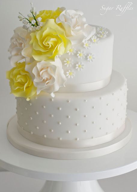 90+ Showstopping Wedding Cake Ideas For Any Season | Shutterfly Wedding Cake Designs Yellow, Cake With Yellow Flowers, Yellow And White Wedding, Unfrosted Cake, 2 Tier Wedding Cakes, Yellow Wedding Cake, Spring Wedding Cake, White Cake Recipe, Chocolate Wedding Cake