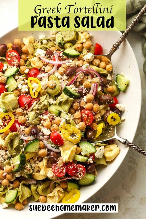 Our Greek Tortellini Pasta Salad combines fresh cheese-filled tortellini pasta, feta cheese, kalamata olives, garbanzo beans, and tons of veggies - all topped with a delicious Greek vinaigrette. This is a delicious summer salad that the whole family will love! Greek Tortellini Pasta Salad, Greek Tortellini, Garbonzo Beans, Cheesy Tortellini, Tortellini Pasta Salad, Greek Vinaigrette, Greek Dressing, Pasta Salad With Tortellini, Tortellini Pasta