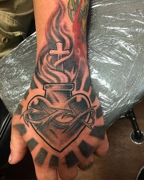 Love Tattoos For Men Heart, Sacred Heart Hand Tattoo, Heart Tattoo For Men, Tattoos For Guys Wrist, Heart Tattoo Men, Heart Neck Tattoo, Heart Hand Tattoo, Hand Heart Tattoo, Tattoos Words