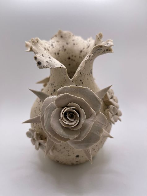 Introducing the Perfect Original Ceramic Sculpture for Your Home Décor: The Garden Vessel! This Garden Vessel features meticulously handcrafted Forever Roses and posies. A labor of love, each delicate petal is expertly sculpted, creating a lifelike masterpiece that will elevate the look of your home décor and become an heirloom piece for generations to come. It weighs 1 pound and is approximately 5 x 4 inches wide and 6 inches tall. The Garden Vessel is also a unique and thoughtful present ideal Forever Roses, Flower Sculpture, Ceramics Pottery Vase, Sculpture Ceramic, Flower Sculptures, Decorations Table, Forever Rose, Ceramic Flower Pots, Bereavement Gift