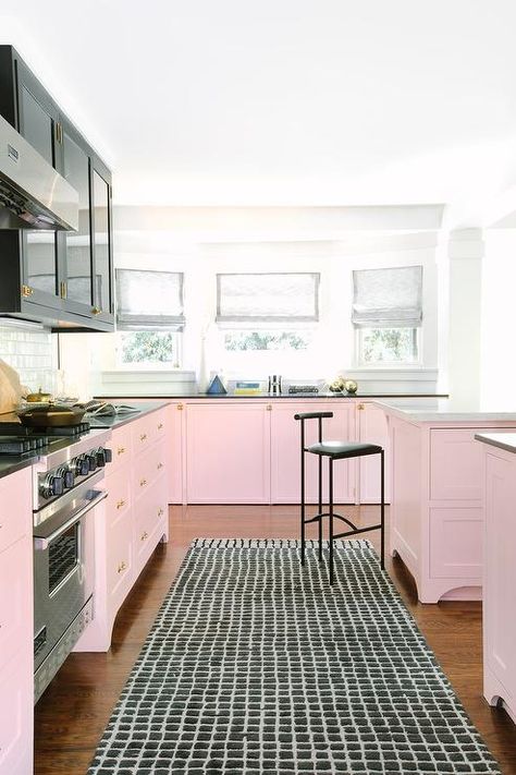 Welcoming pink and black contemporary kitchen features a pink island topped with a black quartz countertop and paired with black counter stools. Pink Kitchen Cabinets, Pink Refrigerator, Pink Pictures, Fine Paints Of Europe, Kitchen Cabinets Pictures, Pink Island, Pink Paint Colors, Kabinet Dapur, Kitchen Colour Schemes