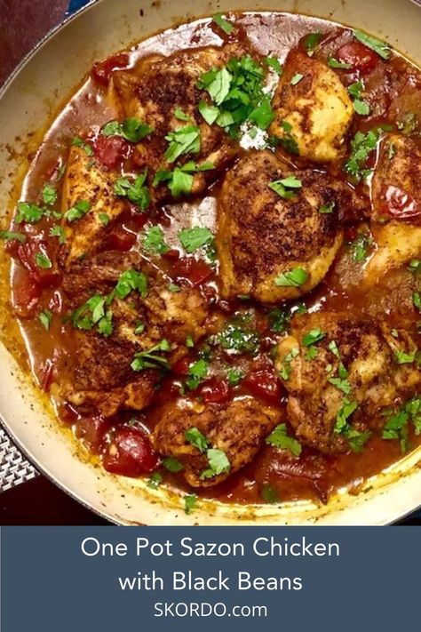 Large saucepan with browned chicken things siting in a red chunky broth with black beans and garnished with fresh cilantro Chicken Sazon Recipes, Goya Sofrito Recipes Chicken, Sazon Seasoning Recipes Chicken, Goya Sofrito Recipes, Sazon Goya Recipes Chicken, Sazon Seasoning Recipes, Sazon Goya Recipes, Sazon Chicken, Goya Sazon Recipe