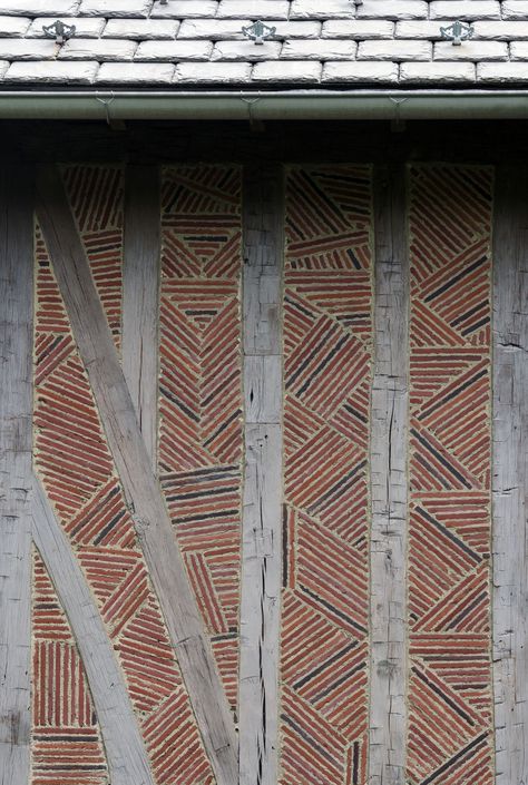 A custom made Ludowici Roman brick was used as nogging to infill in between the timber bays. The "random" pattern of the bricks was meticulously designed and coordinated. #redbrick #randombrickpattern #halftimbering #slateroof #traditionalarchitecture #frenchnormandystyle #farmhouse #rusticdesign #housebarn Green Brick House, Roman Brick, Brick Screen, Brick Works, Architectural Materials, Natural Stone Wall, Garden Paving, Timber Buildings, House Design Pictures