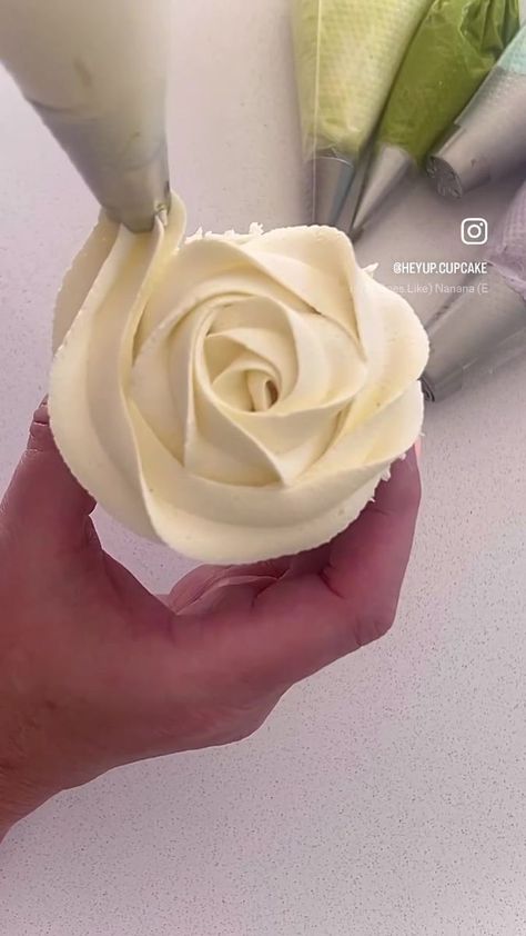 Ribbon roses ! Really simple & quick to do but you can jazz these up to coordinate with your other cupcake designs ….I’m using a wilton 2D for the ribbon... | By Hey Up Cupcake Wilton 2d Tip, Wilton 2d, Cupcake Ring, Rose Icing, Elegant Cupcakes, Cupcake Icing, Cupcake Designs, Ribbon Roses, Cup Cakes