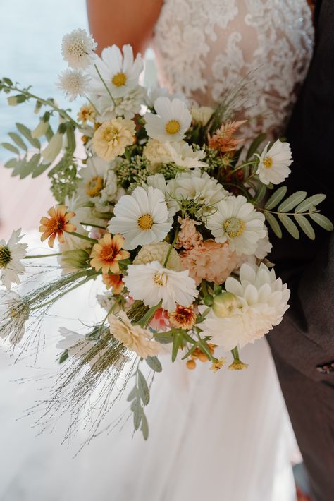 Inspired by New England summer days by the lake, waterskiing, fresh wildflowers combined with pure elegance. We had the most beautiful fresh wildflowers that were also used on an edible floral cake! #wildflowerweddingbouquet #lakesideelopement #lakewedding #lakesidewedding #waterskiwedding #essenceofaustralia Cosmos Wedding Bouquet, Cosmos Wedding, White Cosmos, Wildflower Wedding Theme, Wildflower Wedding Bouquet, Late Summer Weddings, Summer Wedding Bouquets, Daisy Wedding, Wedding Flowers Summer