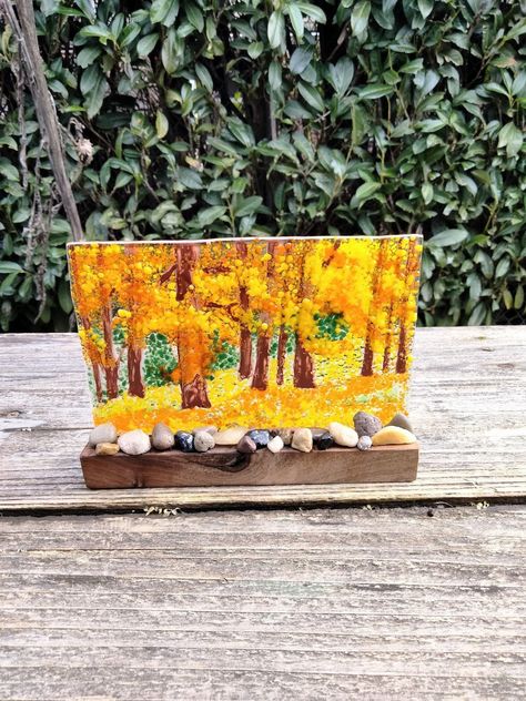 I Love Fall! - glass frit and glass paint are fused in a kiln to create this beautiful fall landscape. Set in a handmade refurbished wooden stand with real rocks glued to the front of the stand. Perfect for the window ledge, desk, or table to catch the natural light or sunlight. It looks great in the sunlight with all those vibrant fall colors. You can feel the texture of the frit, this is not smooth glass. I included my inspiration in the group of pictures. Fused Glass Fall Ideas, Fall Fused Glass Ideas, Glass Frit Painting, Frit Painting, Glass Frit, Window Ledge, Fused Glass Artwork, Glass Fusing Projects, Fall Landscape