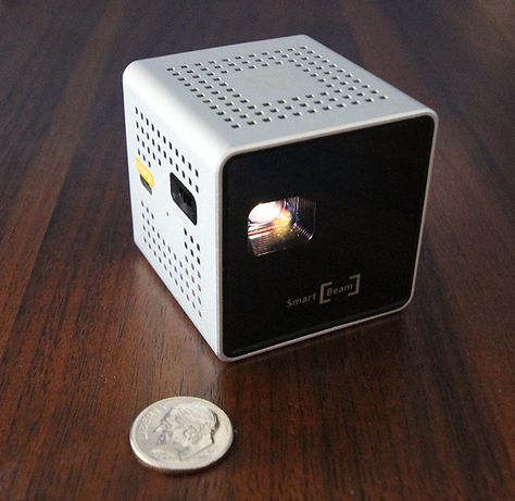 Even by the standards of pico projectors, this thing is tiny: an actual projector of images barely larger than a crabapple.Battery powered and with an HDMI input, it's a mighty mini...maybe. Pico Projector, Bose Soundlink, Bose Speaker, Projector, Beams, Electronic Products