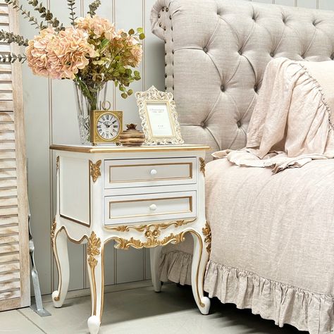 A charming White and Gold French Provincial Bedside Table that brings elegance to any bedroom. Featuring intricate gold detailing and a timeless French-inspired design, this piece offers both style and functionality with its spacious drawer and open shelf for storage. Perfect for adding a touch of luxury to your decor. French Provincial Bedside Table, Shelf For Storage, Open Shelf, French Provincial, French Inspired, Gold Details, Open Shelving, Bedside Table, Drawers