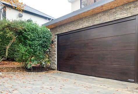 Hormann LPU 42 L Ribbed Insulated Sectional Garage Door Finished in Rosewood & Installed By Our New Malden Branch. Quickly, conveniently and safely open your garage door from your car using a hand transmitter. We can automate your new or old garage door, so call us on 0800 716 569 or visit www.accessgaragedoors.com to find out more. #AccessGD #Hormann #GarageDoor #NewMalden Old Garage Door, Garage Door Opener Installation, Sectional Garage Doors, Old Garage, Garage Conversion, Garage Door Repair, Door Repair, Garage Door Opener, Urban Jungle