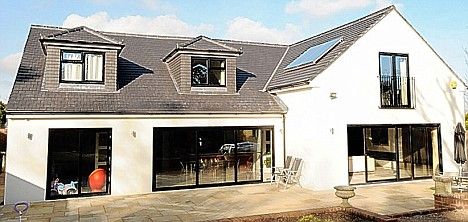 Same roof tiles to tile the dorma cheeks etc. An alternative to boarding. Works well with  simple render and dark windows. Dormer House, Bungalow Conversion, Dormer Bungalow, Rendered Houses, Bungalow Extensions, Bungalow Renovation, Bungalow Exterior, Bungalow Homes, Modern Garage