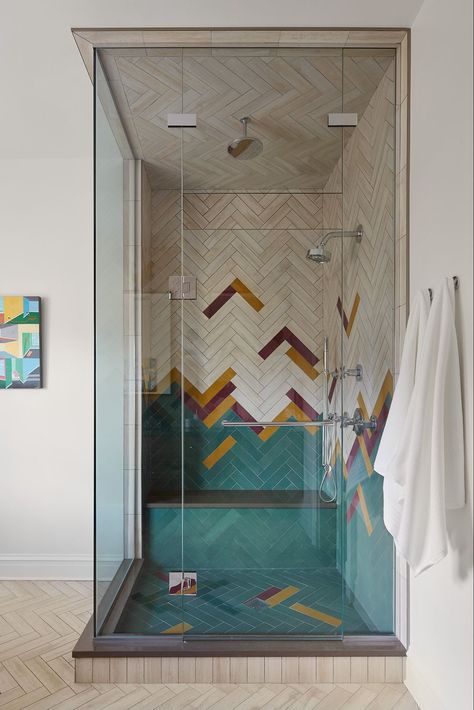 While blue and green shower tiles work perfectly in the bathroom, don't fear the use of other bold colors—such as reds, oranges, and yellows. Design by 2to5 Design. Moroccan Inspired Bathroom, Green Shower Tile, Yellow Painted Walls, Blue Shower Tile, Vibrant Bathroom, Shower Design Ideas, Custom Tile Shower, Industrial Style Bathroom, Walk In Shower Designs