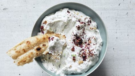 Yoghurt, both plain and with cucumbers, is a staple of Iranian tables – the thicker and sourer, the better. As a kid, I used yoghurt not only to balance sweetness and richness, but also to cool down food that was too hot to eat. Mast-o khiar is an everyday side, and one of my favourites. Dice, rather than grate, the cucumbers to keep them from getting watery, and don't skip the dried herbs, which add dimension to the fresh herbs. Indian Raita, Cucumber Yogurt Salad, Greek Tzatziki, Tomato And Onion Salad, Sausage Sauce, Cucumber Yogurt, The Joy Of Cooking, Persian Cuisine, Corn Muffin Mix