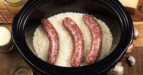 This creamy, cheesy, carb-y, and comforting dish is a pain to make if you do it on the stovetop, but this slow cooker version couldn’t be simpler or more delicious. Italian Sausage Rice, Recipes Italian Sausage, Toasted Hot Dog Buns, Sausage Risotto, Slow Cooker Sausage, Slow Cooker Kitchen, Sausage Rice, Beer Brats, Recipes Italian