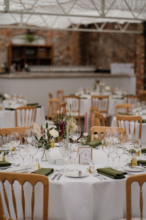 Green Wedding Napkins Table Settings, Round Table White Tablecloth, Whimsical Wedding Round Table, Simple Centrepiece Wedding Round Table, Wild Flower Round Table, Round Table Dinner Setting, Simply Wedding Table Decor, Circular Tables Wedding, Wedding Table White Tablecloth