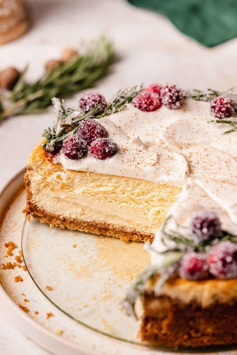 This eggnog cheesecake with gingersnap crust and rum infused whipped cream is rich, creamy, and packed full of creamy eggnog flavor! Flouring Kitchen Eggnog Cheesecake, Eggnog Cheesecake With Gingersnap Crust, Xmas Cheesecake, Eggnog Dessert Recipes, Cheesecake With Gingersnap Crust, Cheesecake Flavors, Eggnog Cheesecake Recipe, Holiday Cheesecake, Creamy Eggnog