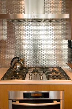 Stainless Steel Kitchen Backsplash | Cheap Remodeling Ideas Stainless Steel Tile Backsplash, Modern Metal Kitchen, Metal Backsplash Kitchen, Cheap Remodel, Stainless Steel Backsplash, Silver Tile, Steel Backsplash, Faucet Repair, Small Tiles